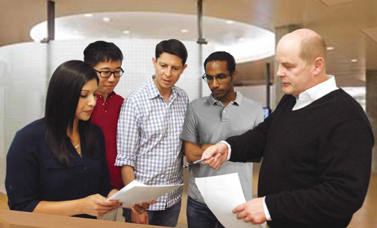 Group of students and faculty talking