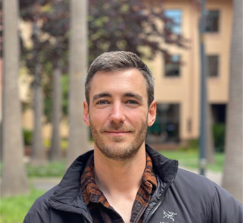 Photo of Robert outside in front of trees