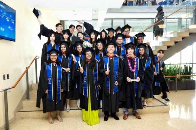 Photo of group of grads on staircase