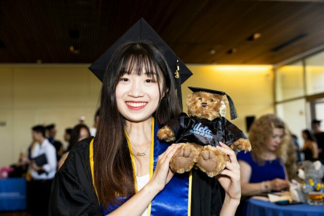 Photo of student holding UCLA bear